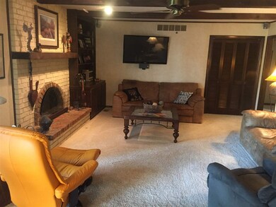 Featuring a full masonry woodburning fireplace wit