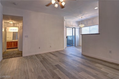 Unfurnished room with wood finished floors, a ceil