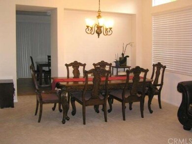 The 6 seat dining room table fits comfortably. Lig
