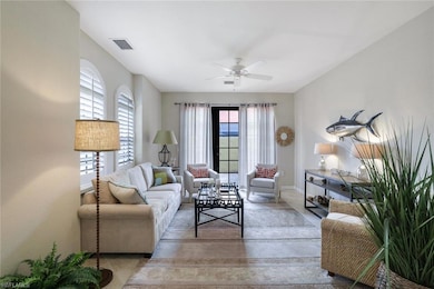 Living room with light tile patterned flooring and