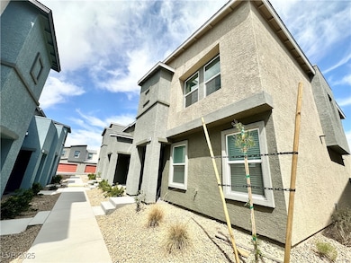 View of side of home featuring stucco siding