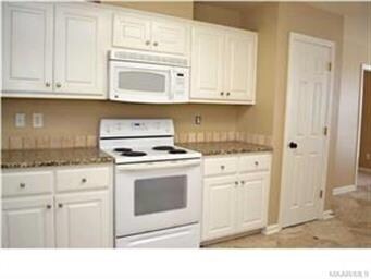 Ample cabinet space and a pantry keep the countert