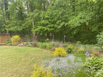 View of backyard with flowers that bloom from spri