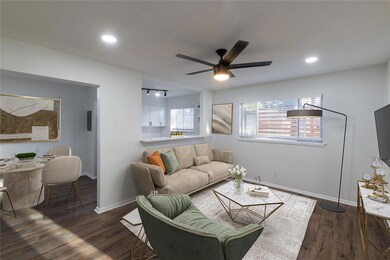 Living area featuring dark wood-type flooring, rec