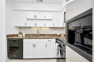 The kitchen has plenty of storage.
