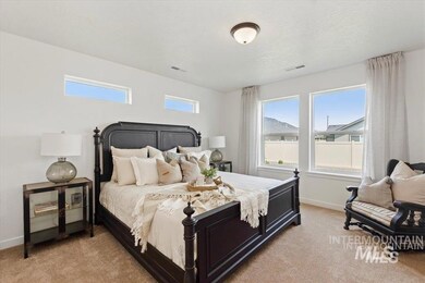 Bedroom with light colored carpet