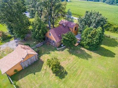 CEDAR SIDING ON A 2 STORY HOUSE THAT SITS ON 2 ACRES. WOODED LOT ALLOWS PRIVACY. DETACHED GARAGE WITH ATTACHED WORKSHOP, DETACHED SHED, LANDSCAPED, FENCED IN BACKYARD