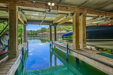 Dock with boat lift and a water view