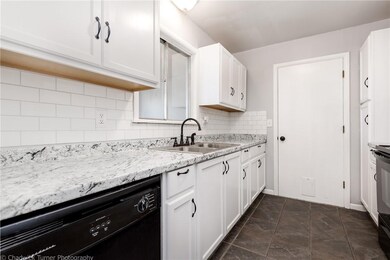 Kitchen has new counters and backsplash