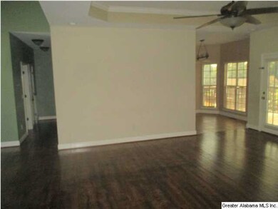View from the living room toward the kitchen and b
