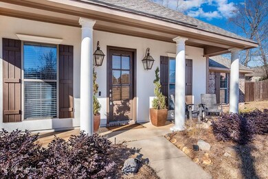 View of exterior entry with a porch