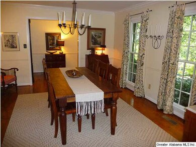 Living room is being utilized as dining room looki
