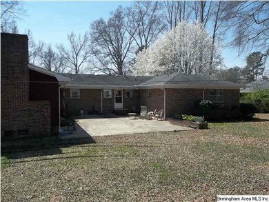 Back view of home with large patio for entertainin