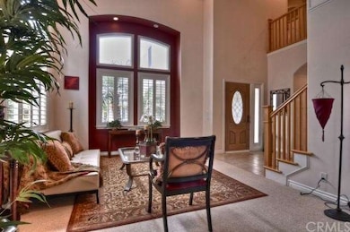 Living room with view of front door and entry way.