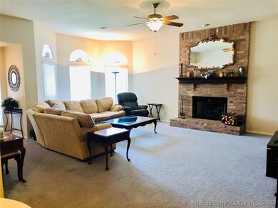 Spacious living room with tall ceilings and bay wi