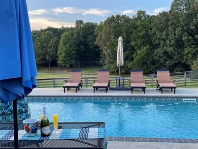 Enjoy An Evening Cocktail By The Pool And Watch Th
