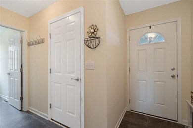 Front door-coat closet and laundry room