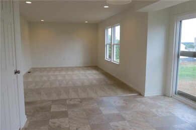 Kitchen open to the Breakfast Nook and Family Room