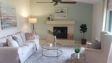 living room with wood burning fireplace.