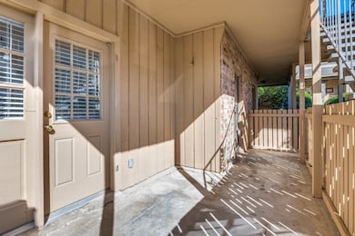 Property entrance featuring stone siding