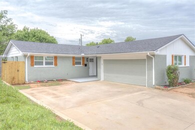Ranch-style home with roof with shingles, fence, a