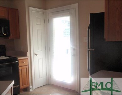 Kitchen. Kitchen conveniently leads to side porch.