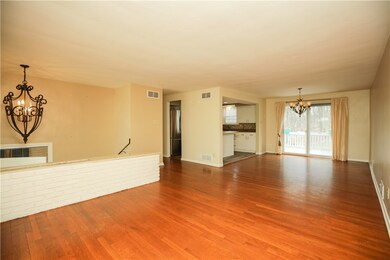 The area by the double doors is the dining area.