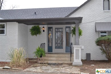 Covered Side Entry by the Circular Driveway