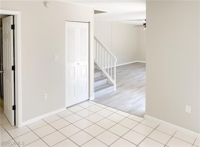 Unfurnished room with light tile patterned floorin