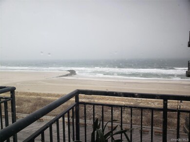 View of ocean, beach, boardwalk