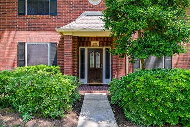 front walk way to entrance of this traditional style home