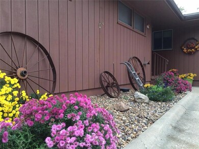 Pretty perennials accent the front of home plus do