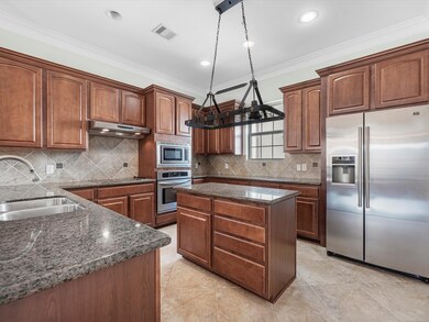 The kitchen features updated stainless steel appli