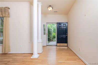 Entryway featuring decorative columns and light wo