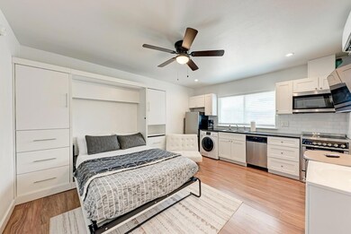 Bedroom featuring washer / clothes dryer, light w