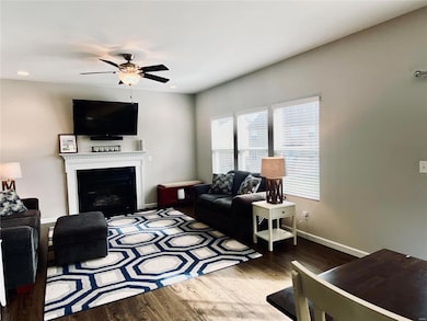 Cozy family room with gas fireplace. 9 foot ceilin