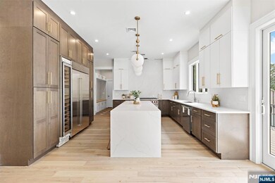 A Chefâ€™s dream Kitchen boasts a Wolf Oven, Sub-Zero Fridge, Wine Fridge, Designer Finishes