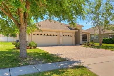 FRONT OF HOME WITH 3 CAR GARAGE AND PAVERS