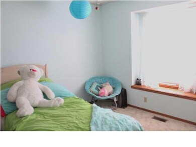 Bedroom 2 with window seat and lots of light