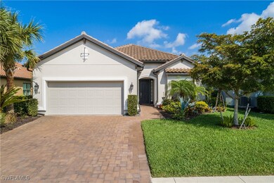 Mediterranean / spanish-style house featuring a ga