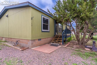 View of side of property with crawl space