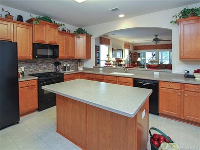 Spacious kitchen with an island for the extra stor