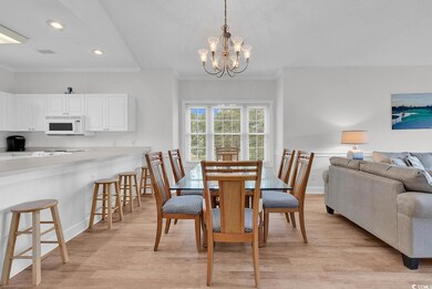 Dining room with light wood-style floors, crown molding, a chandelier, recessed lighting, and baseboards