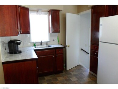 updated kitchen with plenty of cabinets and counte