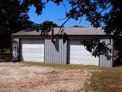 Parking Lot/Garage. Workshop has 2 bays and a fire