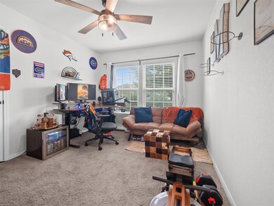 Office space with carpet and ceiling fan