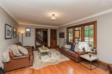 The living room has a built in storage area, firep