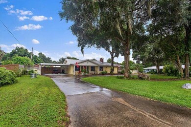 Long driveway with plenty of parking and a circle 