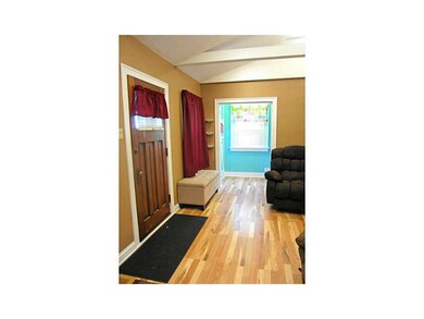 Family Room-L1. Newer laminate flooring, white tri