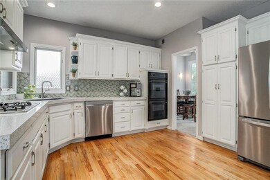 Gleaming hardwood floors, abundant white painted c